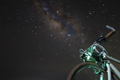 Low angle view of bicycle against sky field