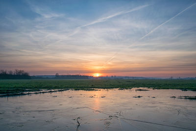 Scenic view of landscape against sky during sunset