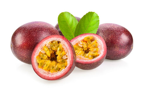 Close-up of fruits against white background