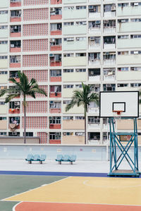 Buildings by swimming pool in city