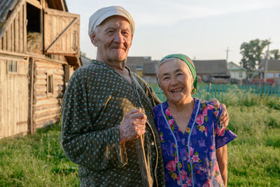 Portrait of a smiling elderly couple in a village
