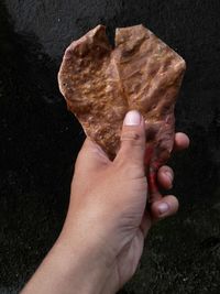 Close-up of hand holding ice cream