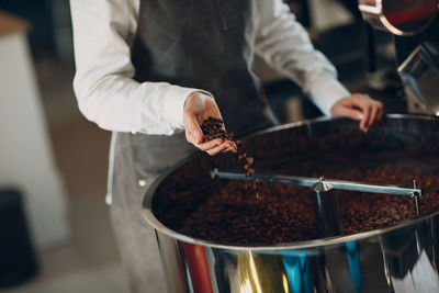 Midsection of man preparing food