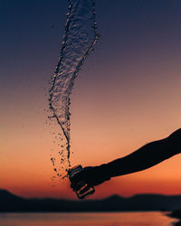 Close-up of silhouette against clear sky during sunset