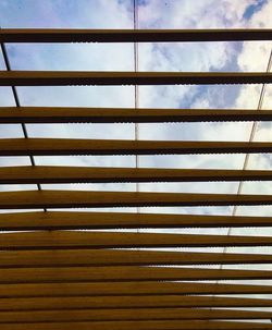 Full frame shot of patterned wall against sky