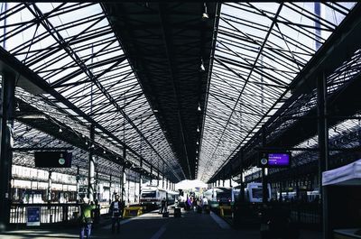 People walking on railroad station platform