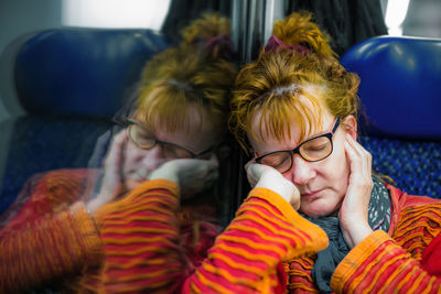 Woman sleeping in bus