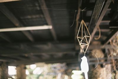 Low angle view of illuminated lighting equipment