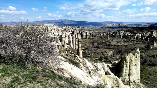 Panoramic view of rock formations against sky