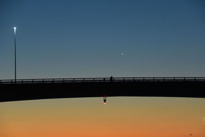 Low angle view of bridge against clear sky