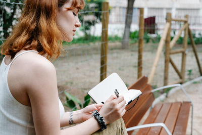 Urban portrait of a young woman in the middle of the city