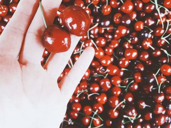 Close-up of hand holding strawberry