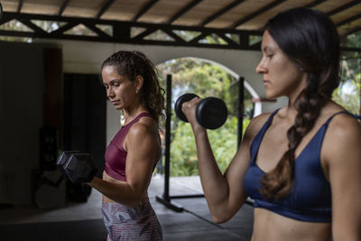 Young woman exercising in gym