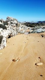 Scenic view of beach against clear sky