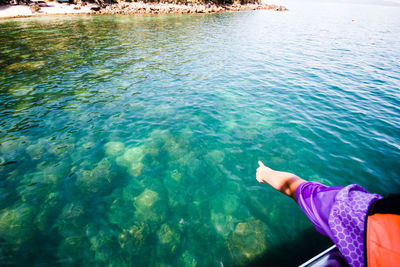 Low section of man in sea