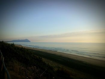 Scenic view of beach against clear sky