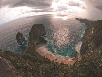 High angle view of rocks in sea against sky