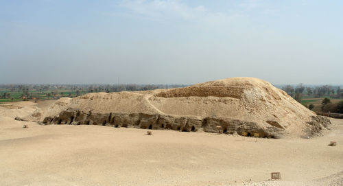 Panoramic view of arid landscape against sky