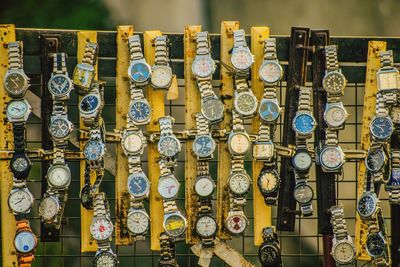 Wristwatch hanging in market for sale