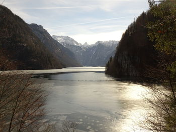 Scenic view of lake and mountains against sky