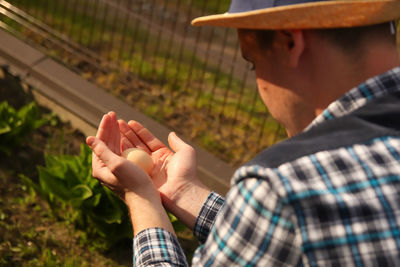 Side view of man using mobile phone