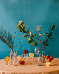 View of plant in vase on table against blue sky