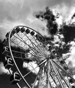 Low angle view of ferris wheel against sky