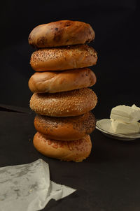 Stack of bagels on table