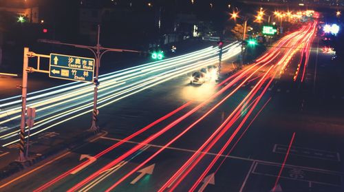 High angle view of light trails on road at night