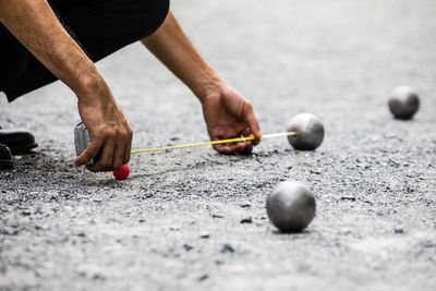 Close-up of man playing with ball