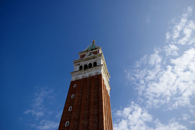 Low angle view of clock tower against sky