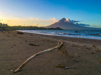 Scenic view of beach against sky during sunset