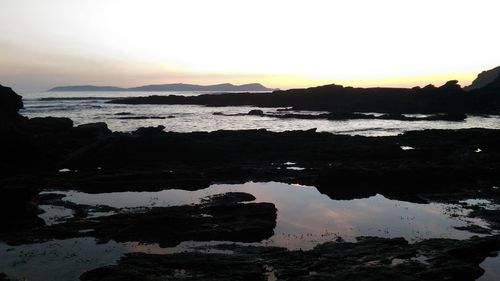 Scenic view of sea against sky during sunset