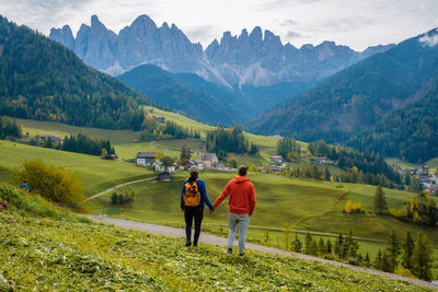 Rear view of man walking on mountain