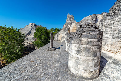 Mayan ruins against clear sky in city