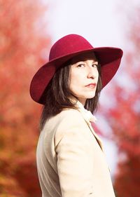 Portrait of beautiful young woman wearing hat