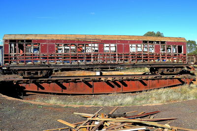 Graffiti on building against blue sky