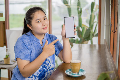 Young woman using mobile phone