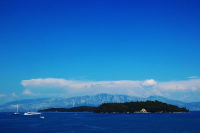 Scenic view of sea against blue sky