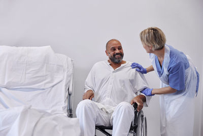 Nurse taking care of patient in hospital