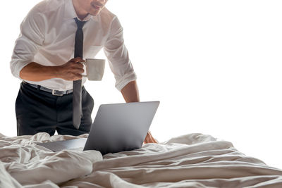 Low angle view of man using laptop