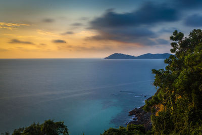 Scenic view of sea against sky at sunset