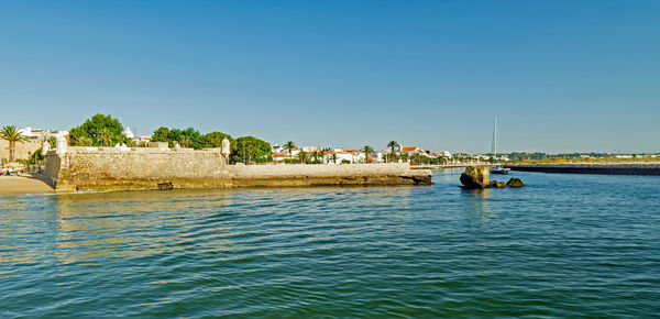 Scenic view of sea against clear blue sky