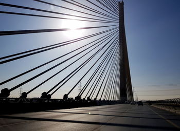 Silhouette bridge against sky