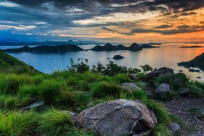 Scenic view of lake against sky during sunset