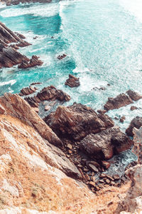 High angle view of rock formation in sea