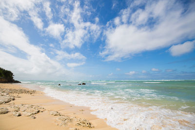 Scenic view of beach against sky