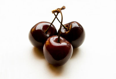 Close-up of fruit over white background