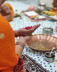 Midsection of woman preparing food