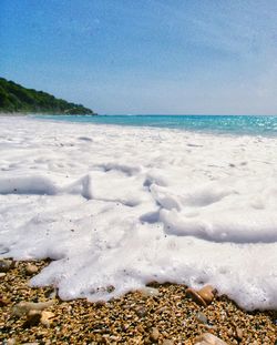 Scenic view of beach against clear sky